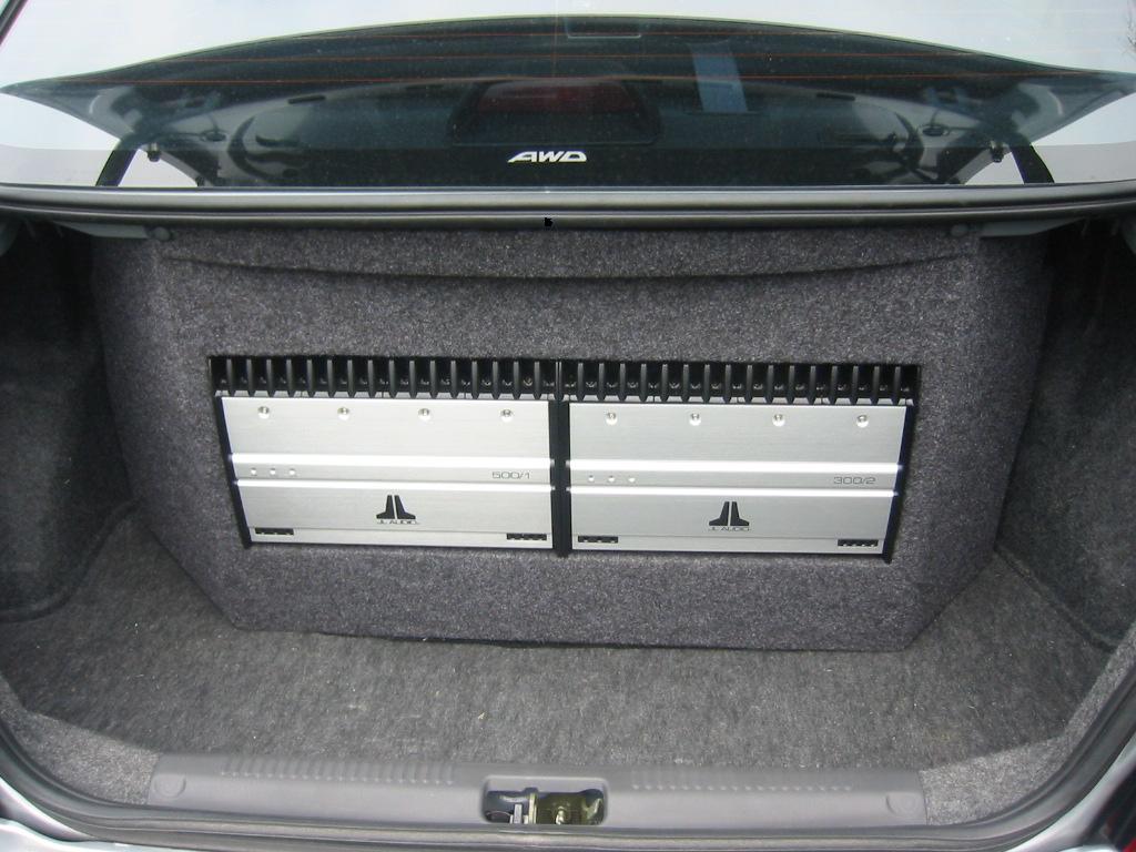 Two JL Audio amps on the custom sub enclosure/><p class=